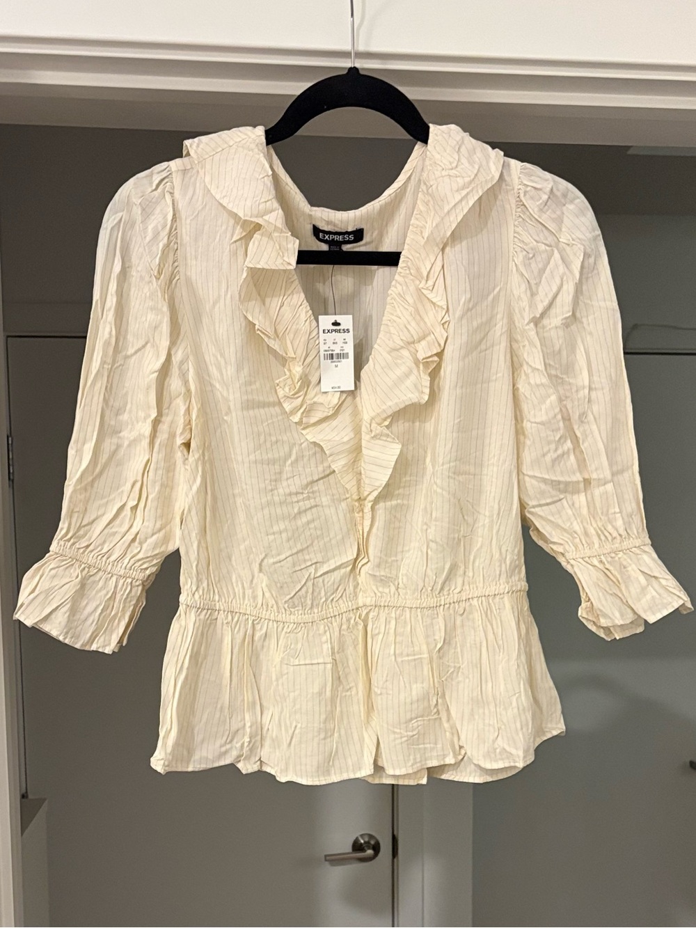 Express Light Cream Ruffled V-Neck Peplum Blouse